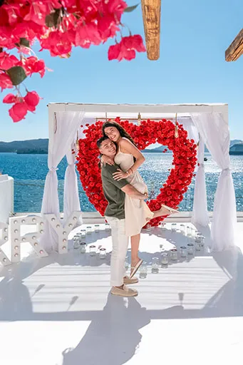 Couple during a Santorini proposal package photoshoot