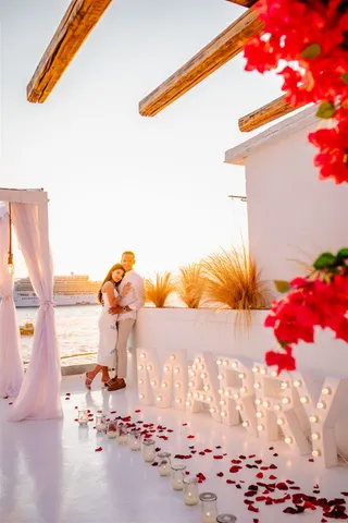 Santorini marry me lights sunset