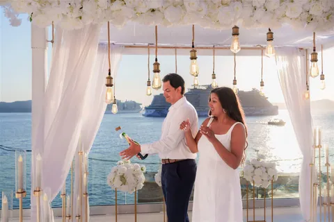 Santorini proposal champagne celebration