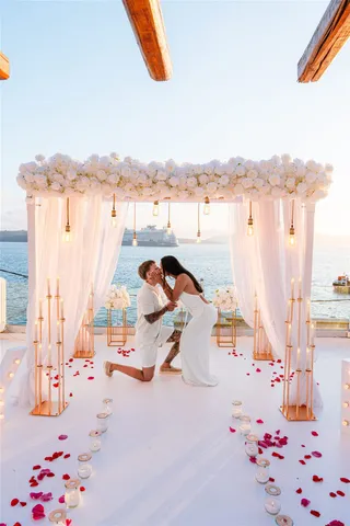 Santorini proposal kneeling golden hour